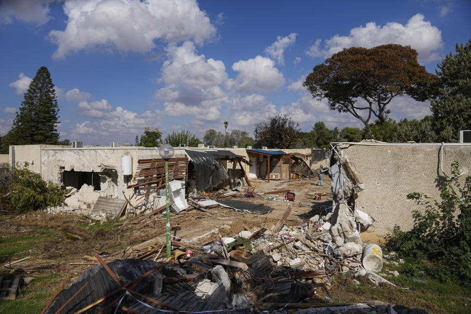 Destroyed houses are seen in Kibbutz Kfar Azza, southern Israel, Sunday, Oct. 15, 2023. The kibbutz was overrun by Hamas militants from the nearby Gaza Strip on Cot.7, when they killed and captured many Israelis. (AP Photo/Ohad Zwigenberg)