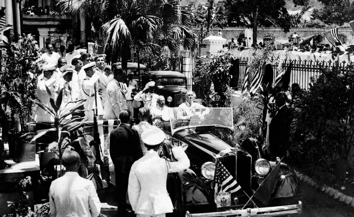 U.S. President Franklin D. Roosevelt, right, and Haitian President Sténio Joseph Vincent, ride in a car that carried them to the Union Club in the northern port city of Cap-Haïtien, Haiti, July 6, 1934. Roosevelt was the first U.S. president to visit Haiti. The United States’ 19-year occupation would end a month later.