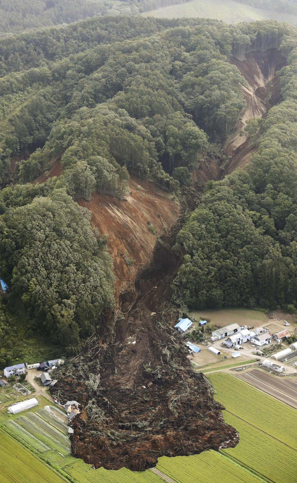 <p>This aerial photo shows the site of a landslide after an earthquake in Atsuma town, Hokkaido, northern Japan, Thursday, Sept. 6, 2018. (Photo: Kyodo News via AP) </p>