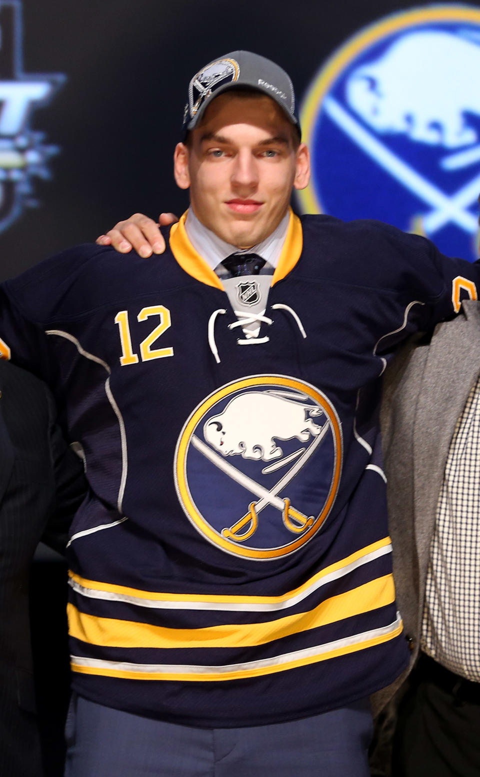 PITTSBURGH, PA - JUNE 22: Zemgus Girgensons, 14th overall pick by the Buffalo Sabres, poses on stage during Round One of the 2012 NHL Entry Draft at Consol Energy Center on June 22, 2012 in Pittsburgh, Pennsylvania. (Photo by Bruce Bennett/Getty Images)