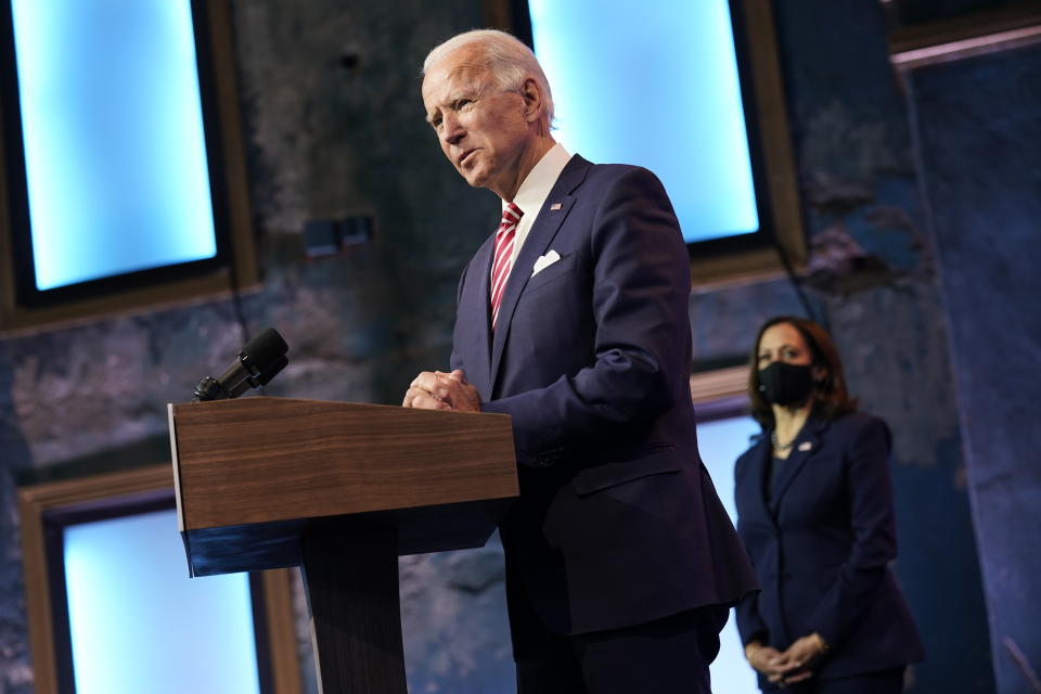 FILE - In this Nov. 16, 2020 file photo, President-elect Joe Biden, accompanied by Vice President-elect Kamala Harris, speaks about economic recovery at The Queen theater, in Wilmington, Del. Amid the new coronavirus pandemic that has devastated the continent for eight months, U.S. voters elected Biden for president, who has promised a more compassionate approach to immigration. (AP Photo/Andrew Harnik, File)