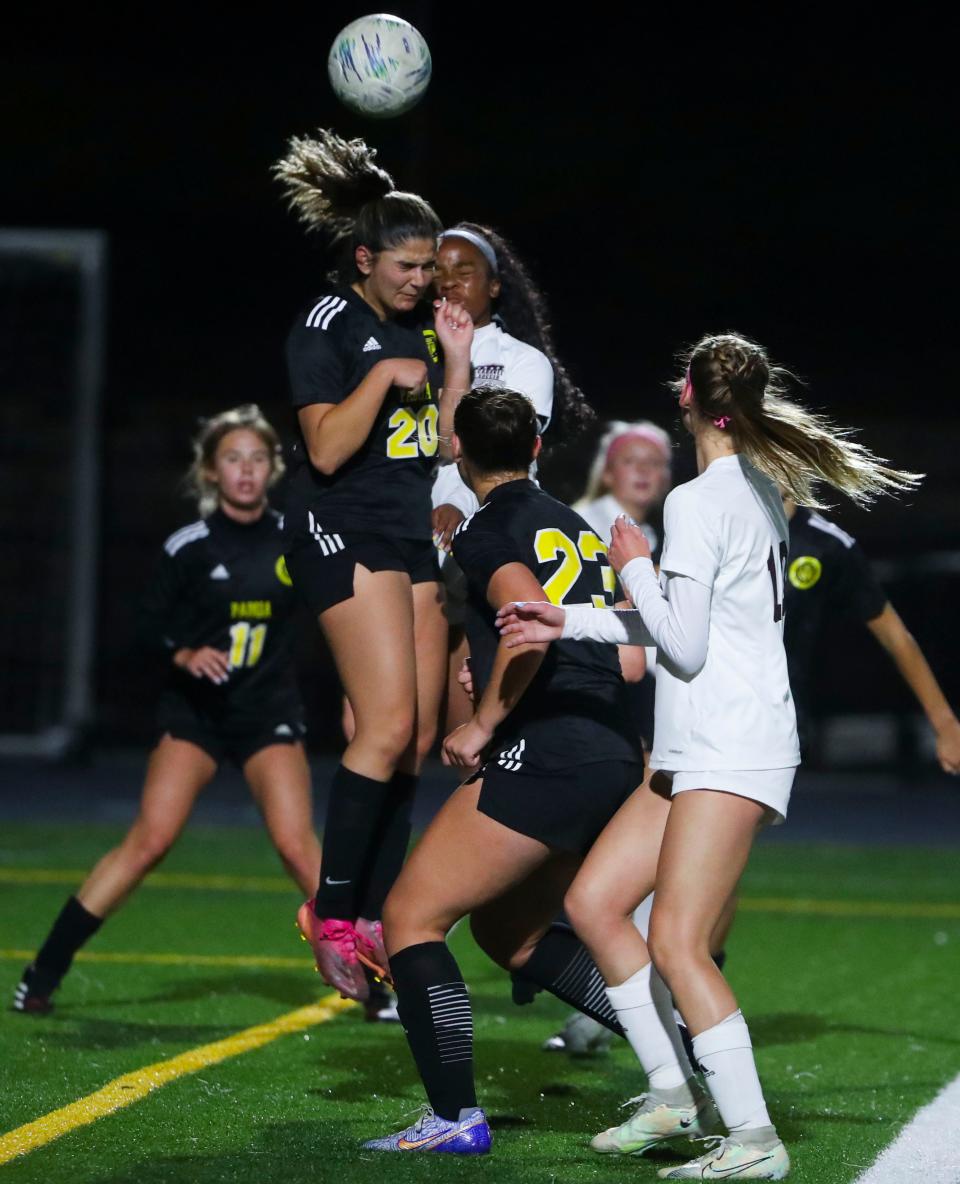 Padua's Katherine Pappas (20) leaps to clear a corner kick via header in the second half of the Bucs' 3-1 win at Abessinio Stadium, Wednesday, May 3, 2023.