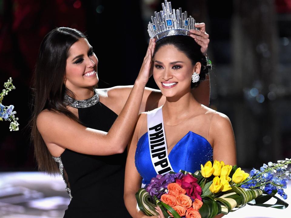 Miss Universe 2014 Paulina Vega (L) crowns Miss Philippines 2015, Pia Alonzo Wurtzbach, the 2015 Miss Universe during the 2015 Miss Universe Pageant at The Axis at Planet Hollywood Resort & Casino on December 20, 2015