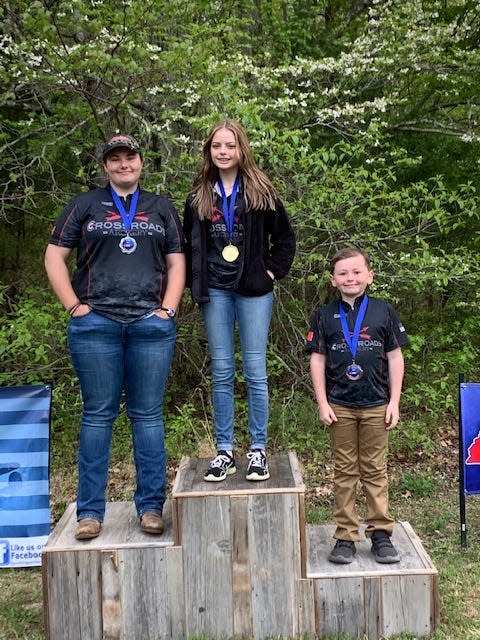 The fun comes after the competition when (from left) Rosey Collins, Marisa Cox and Greyson Carter all found their way onto the awards podium.