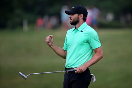 Jul 2, 2017; Potomac, MD, USA; Kyle Stanley celebrates after winning the Quicken Loans National golf tournament at TPC Potomac at Avenel Farm. Mandatory Credit: Peter Casey-USA TODAY Sports