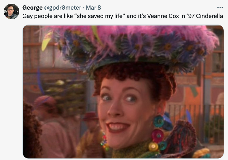 Veanne Cox as Calliope, smiling with a large feathered hat, in a scene from '97 Cinderella