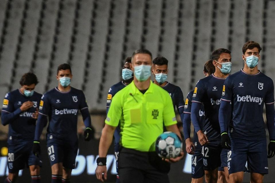 Players from Belenenses walk onto the pitch before their match against Benfica  (AFP via Getty Images)