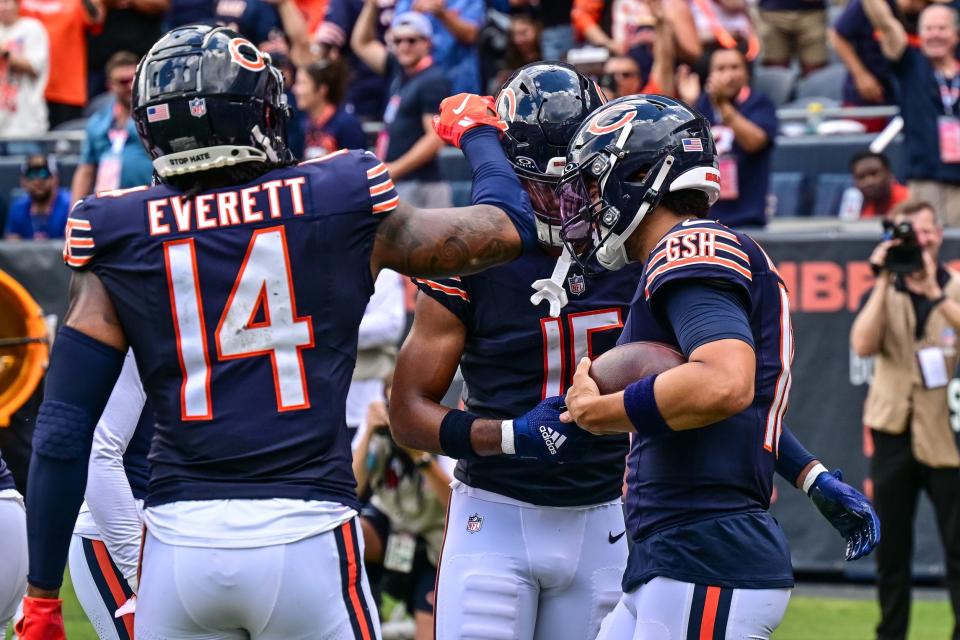 Aug 17, 2024; Chicago, Illinois, USA; Chicago Bears quarterback Caleb Williams (18) celebrates his rushing touchdown against the Cincinnati Bengals during the second quarter at Soldier Field. Mandatory Credit: Daniel Bartel-USA TODAY Sports