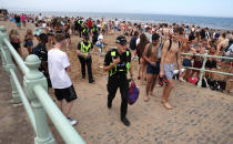 Police at Portobello Beach in Edinburgh after confiscating alcohol from beachgoers.