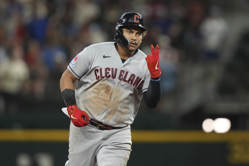 Cleveland Guardians Josh Naylor gestures as he runs the bases after hitting a home run during the third inning of a baseball game against the Texas Rangers in Arlington, Texas, Friday, July 14, 2023. (AP Photo/LM Otero)