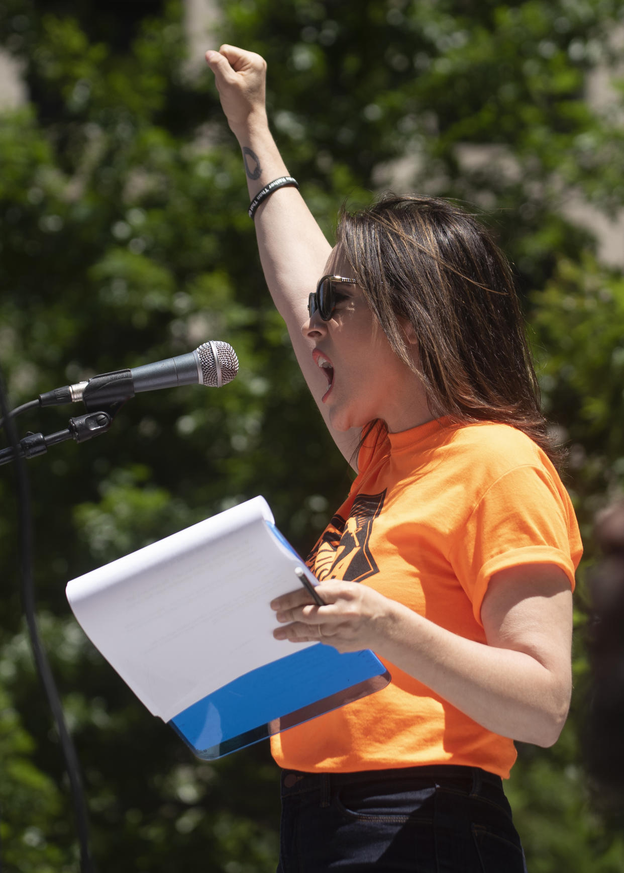 Alyssa Milano, founder of NoRA, reading a list of demands during a protest against the NRA in Dallas on May 5, 2018. (Photo: AP Photo/Rex Curry)