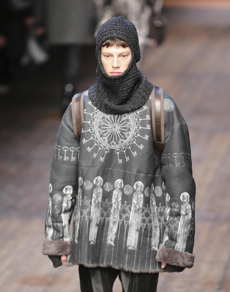 A model wears a creation for Dolce & Gabbana men's Autumn-Winter 2014 collection, part of the Milan Fashion Week, unveiled in Milan, Italy, Saturday, Jan. 11, 2014. (AP Photo/Antonio Calanni)