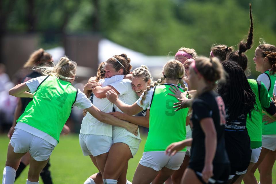 Des Moines Christian celebrates winning the Class 1A girls state soccer championship, on Saturday, June 4, 2022, at the Cownie Soccer Complex, in Des Moines. Des Moines Christian won the title match, 1-0. 