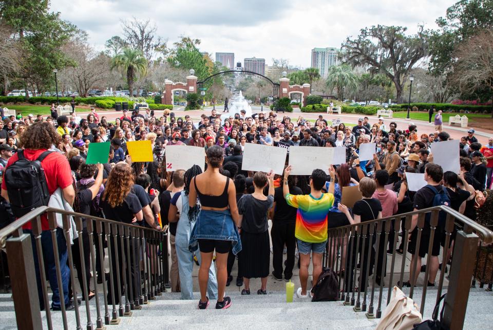 More than 100 people gathered in front of the Westcott Building on Florida State University's campus to protest the DeSantis administration's "attack" on the LGBTQ+ and Black, Indigenous and People of Color (BIPOC) communities on Thursday, Feb. 23, 2023.