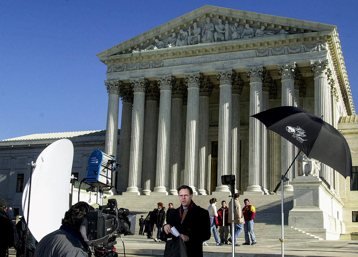 NBC's Pete Williams reports from outside the Supreme Court in Washington on Dec. 4, 2000. (Dennis Cook / AP file)