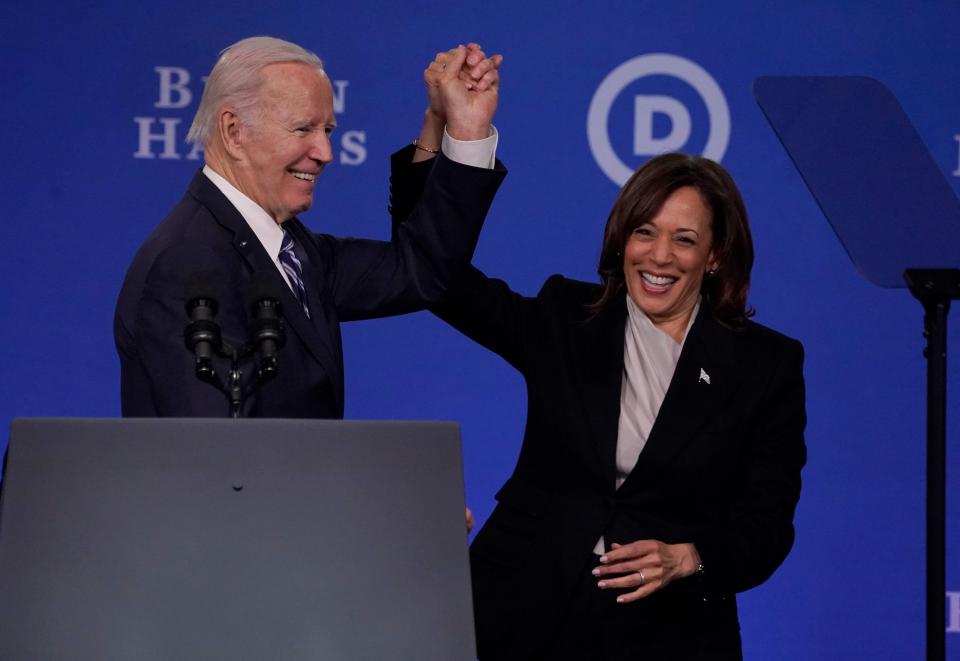 Vice President Kamala Harris and President Joe Biden hold hands at the Democratic National Committee 2023 Winter meeting in Philadelphia, Pennsylvania, on Feb. 3, 2023. The DNC approved a new lineup for the party's presidential primaries at the meeting.