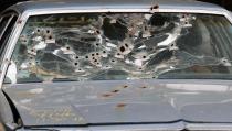 The windshield of Timothy Russell's car is shown as the crime scene was mocked up for the court to review during the manslaughter trial for a police officer in Cleveland, Ohio, in this file photo taken April 10, 2015. The city of Cleveland and the U.S. Justice Department reached a settlement on Tuesday to resolve allegations that the city's police use excessive force against its civilians, the police union Cleveland Police Patrolmen's Association said. (REUTERS/Aaron Josefczyk)