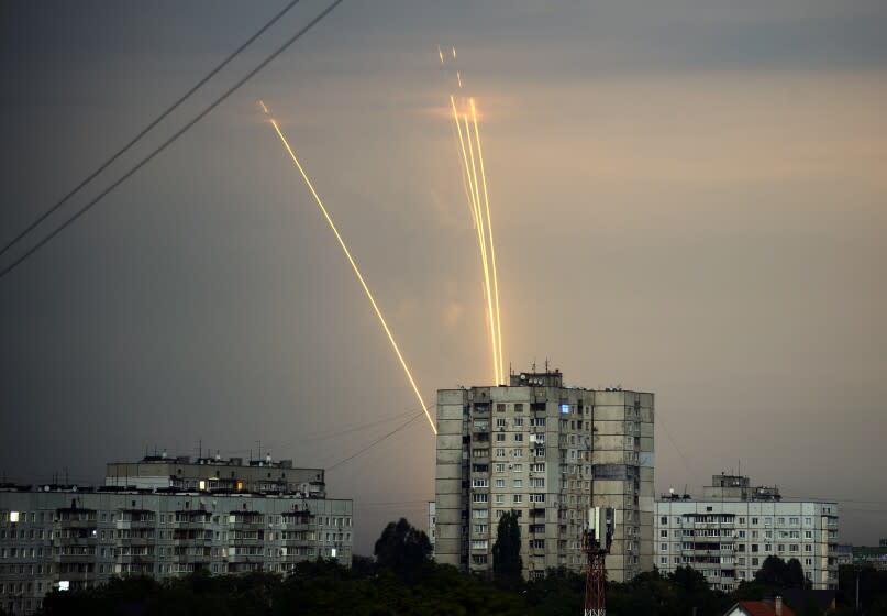 Russian rockets launch against Ukraine from Russia's Belgorod region are seen at dawn in Kharkiv, Ukraine, Monday, Aug. 15, 2022. (AP Photo/Vadim Belikov)
