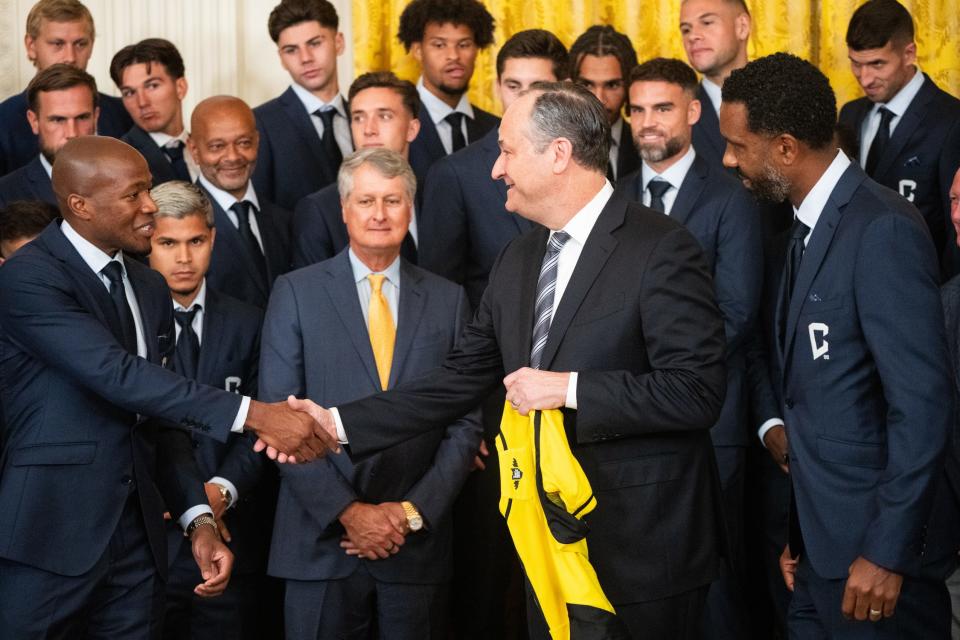 Sep 27, 2024; Washington, DC, USA; Second Gentleman Doug Emhoff receives a commemorative jersey from the Columbus Crew during their visit to the White House to celebrate their Major League Soccer Cup in 2023. The MLS team visited with President Joe Biden and Second Gentleman Doug Emhoff. Mandatory Credit: Josh Morgan/USA TODAY NETWORK via Imagn Images