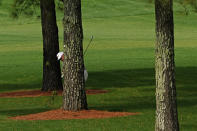 Lee Westwood, of England, hits from behind a tree on the seventh hole during the first round of the Masters golf tournament Thursday, Nov. 12, 2020, in Augusta, Ga. (AP Photo/Matt Slocum)