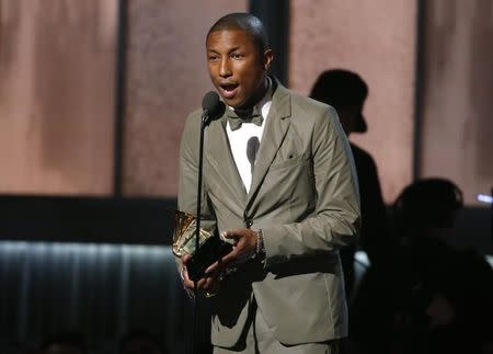 Pharrell Williams accepts the award for best pop solo performance for "Happy" at the 57th annual Grammy Awards in Los Angeles, California February 8, 2015. REUTERS/Lucy Nicholson