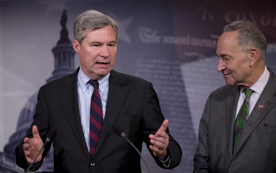 Sen. Sheldon Whitehouse, D-R.I. left, accompanied by Sen. Charles Schumer, D-N.Y., speaks to reporters on Capitol Hill in Washington, Wednesday, April 2, 2014, about the Supreme Court decision in the McCutcheon vs. FEC case, in which the Court struck down limits in federal law on the aggregate campaign contributions individual donors may make to candidates, political parties, and political action committees. (AP Photo/Manuel Balce Ceneta)