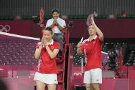 China's Zheng Si Wei and Huang Ya Qiong, left, celebrates a point during their mixed doubles semi-final match against Hong Kong's Tang Chun Man and Tse Ying Suet at the 2020 Summer Olympics, Thursday, July 29, 2021, in Tokyo, Japan. (AP Photo/Markus Schreiber)