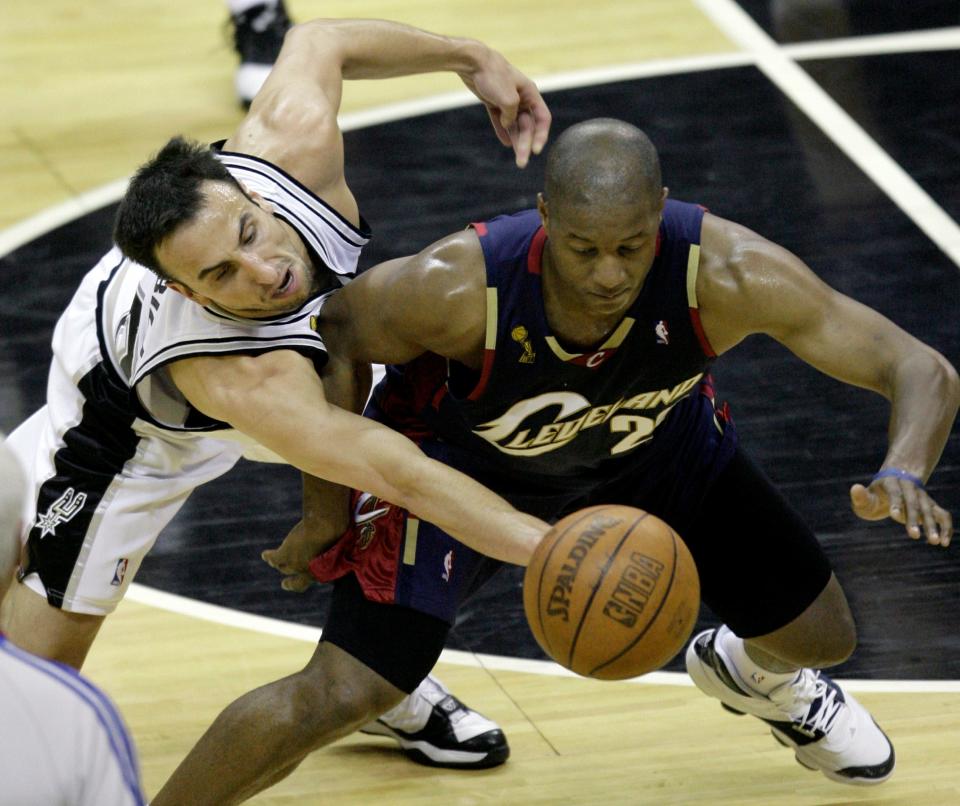 Spurs guard Manu Ginobili, left, knocks the ball away from Cavaliers guard Eric Snow in the second quarter of Game 2 of the NBA Finals in San Antonio, Sunday, June 10, 2007.