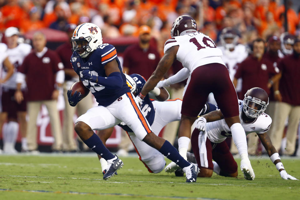 Auburn running back JaTarvious Whitlow, left, breaks loose for a touchdown during the first half of an NCAA college football game against Mississippi State, Saturday, Sept. 28, 2019, in Auburn, Ala. (AP Photo/Butch Dill)