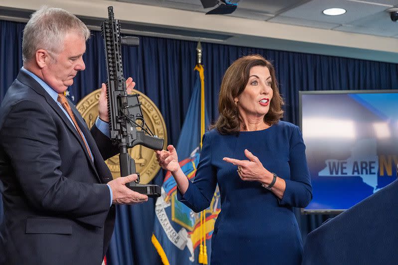 New York Gov. Kathy Hochul shows a firearm during a news conference in Manhattan, New York on Wednesday, May 18, 2022. 