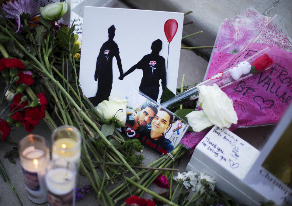 A makeshift memorial to Christopher Andrew Leinonen (R) and his boyfriend Juan Ramon Guerrero (L) on June 19, 2019. They were both killed in the Pulse nightclub mass shooting in Orlando. | David Goldman—AP