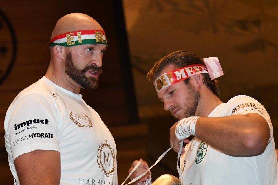 Davison (right) and Tyson Fury ahead of a fight with Wallin in 2019 (Getty)