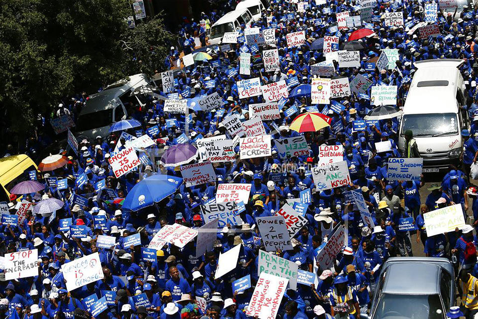 File — Members of the opposition Democratic Alliance (DA) party, march in protest against power cuts in Johannesburg, South Africa, Wednesday, Jan. 25, 2023. Today the ruling African National Congress (ANC) faces growing dissatisfaction from many who feel it has failed to live up to its promises. (AP Photo/File)