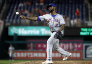 New York Mets shortstop Jose Reyes pitches in relief during the eighth inning of the team's baseball game against the Washington Nationals at Nationals Park, Tuesday, July 31, 2018, in Washington. The Nationals won 25-4. (AP Photo/Alex Brandon)