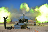 <p>Popular Mobilization Forces (PMF) fires towards Islamic State militants during a battle with Islamic State militants, west of Mosul, Iraq Feb. 22, 2017. (Photo: Stringer/Reuters) </p>