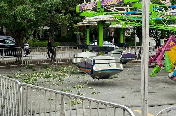 Debris from a tree can be seen on the ground near a carnival ride in Halifax. Jacob Joly said he and his girlfriend hit tree branches while on the ride Wednesday. (Jacob Joly - image credit)