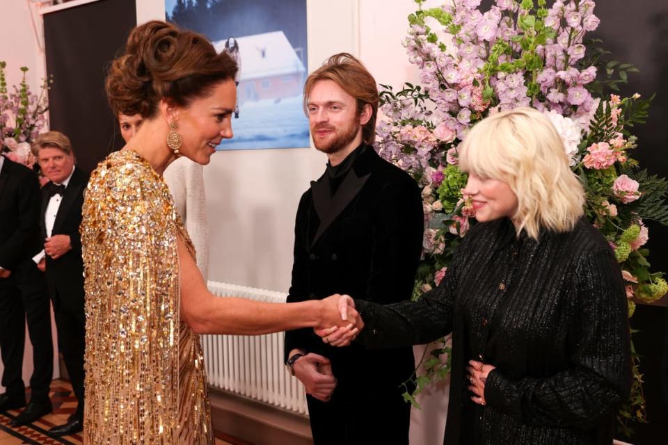 <div class="inline-image__caption"><p>Britain's Catherine, Duchess of Cambridge (L) meets US singer-songwriter Finneas O'Connell (C) and US singer-songwriter Billie Eilish ahead of the World Premiere of the James Bond 007 film "No Time to Die" at the Royal Albert Hall in west London on September 28, 2021.</p></div> <div class="inline-image__credit">CHRIS JACKSON/POOL/AFP via Getty Images</div>