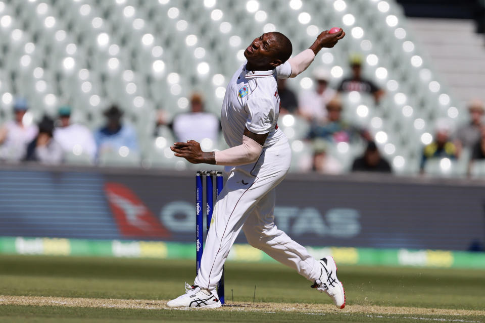 West Indies' Devon Thomas bowls to Australia on the second day of their cricket test match in Adelaide, Friday, Nov. 9, 2022. (AP Photo/James Elsby)