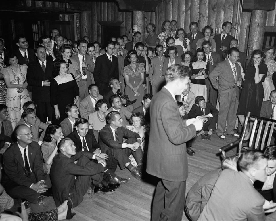 A group of attendees for the British Mission party gathered in Fuller Lodge. National Security Research Center