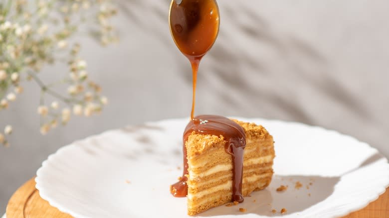 caramel drizzled on a cake