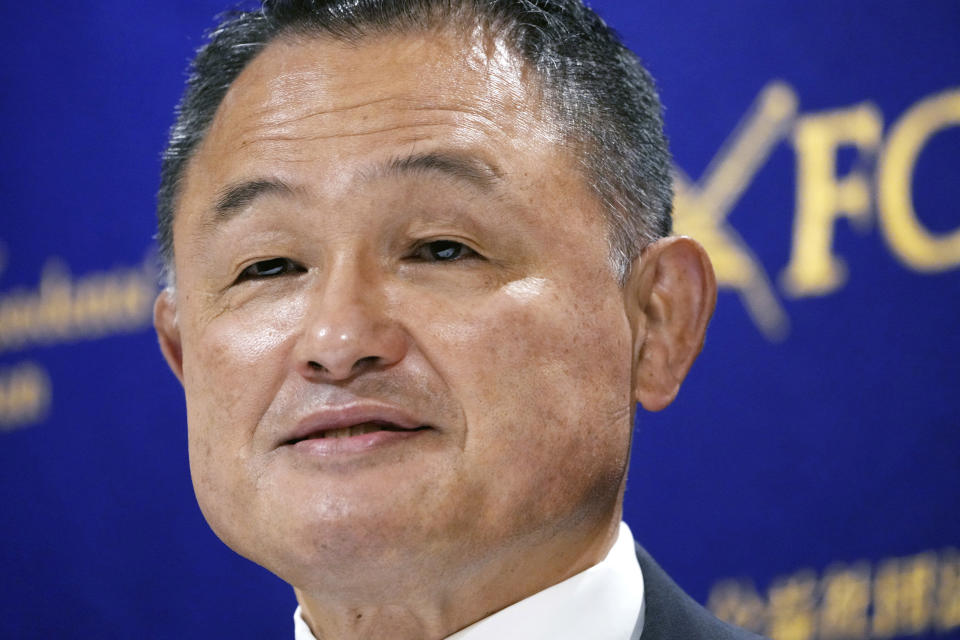 FILE - Yasuhiro Yamashita, President of the Japanese Olympic Committee, poses for photographers prior to a press conference Monday, June 28, 2021, in Tokyo, ahead of the opening of Tokyo 2020 Olympic Games on July 23. Japan announced Friday, Dec. 24, 2021, it won't send a delegation of ministers to represent the government at the Beijing Games but three Olympic officials will attend, a mixed response to a U.S.-led move to boycott the games to protest China's human rights conditions. Chief Cabinet Secretary Hirokazu Matsuno said Tokyo Olympic Organizing Committee President Seiko Hashimoto, Kazuyuki Mori, the president of the Japan Paralympic Committee, and Yamashita will attend. (AP Photo/Eugene Hoshiko, File)