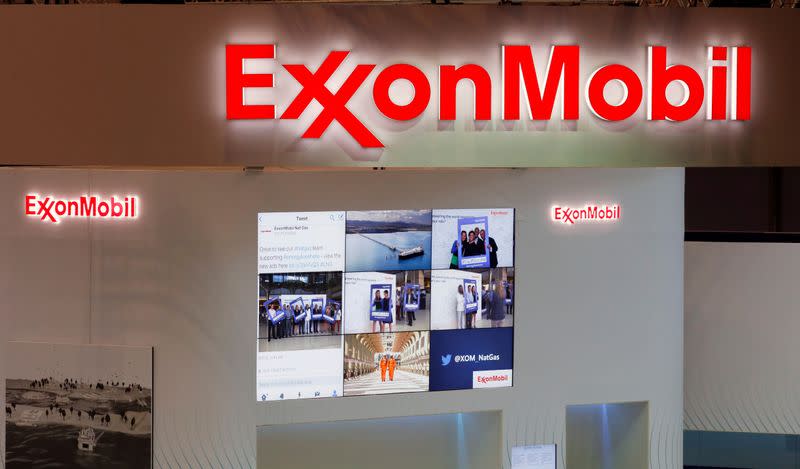 FILE PHOTO: Logos of ExxonMobil are seen in its booth at Gastech, the world's biggest expo for the gas industry, in Chiba