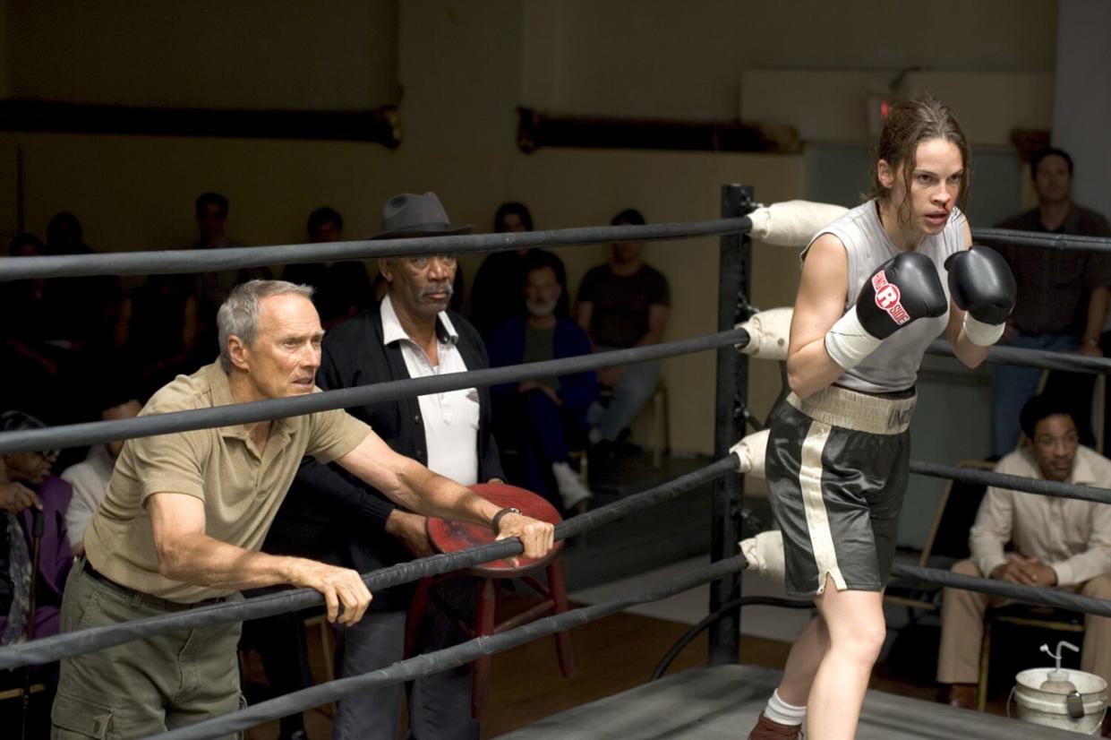 Hilary Swank holds up her arms in the boxing ring in a scene from "Million Dollar Baby."