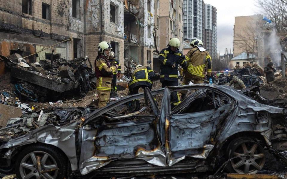 Burnt out cars feature in a scene of devastation in Ukraine's capital