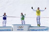 From L-R: Second-placed France's Arnaud Bovolenta with compatriots winner Jean Frederic Chapuis and third-placed Jonathan Midol celebrate on the podium after the men's freestyle skiing skicross finals round at the 2014 Sochi Winter Olympic Games in Rosa Khutor February 20, 2014. REUTERS/Mike Blake