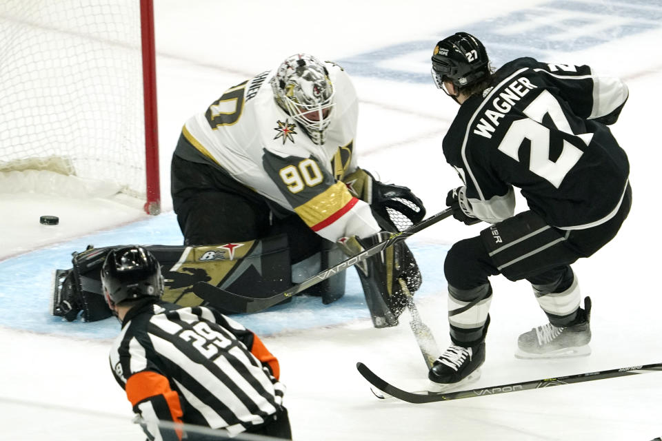 Los Angeles Kings left wing Austin Wagner, right, scores on Vegas Golden Knights goaltender Robin Lehner during the first period of an NHL hockey game Monday, April 12, 2021, in Los Angeles. (AP Photo/Mark J. Terrill)
