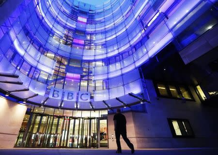 A man enters BBC New Broadcasting House in London November 11, 2012. REUTERS/Luke MacGregor