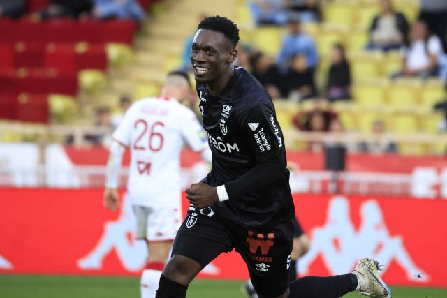 Reims&#39; English forward Folarin Balogun celebrates after scoring a goal  during the French L1 football match between AS Monaco and Stade de Reims at the Louis II Stadium (Stade Louis II) in the Principality of Monaco on March 12, 2023. (Photo by Valery HACHE / AFP) (Photo by VALERY HACHE/AFP via Getty Images)