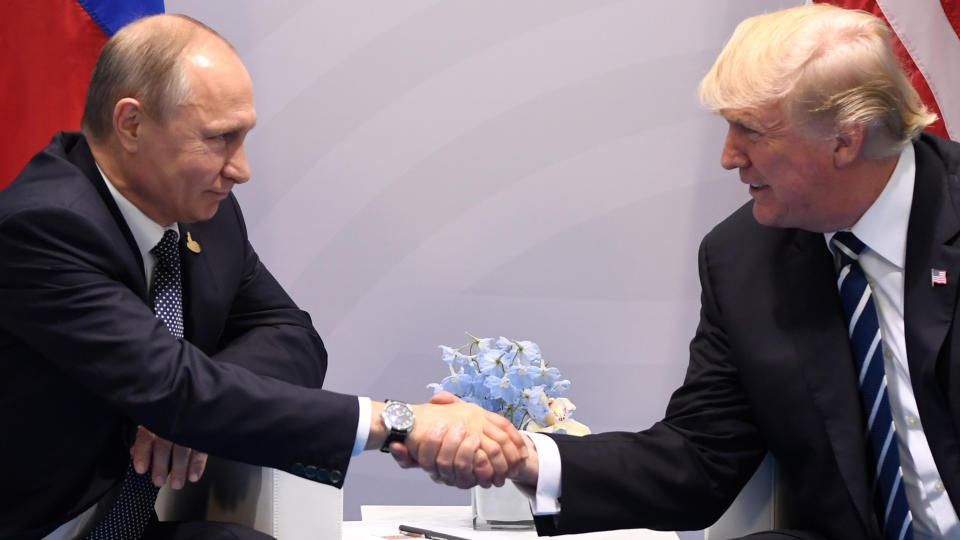 U.S. President Donald Trump and Russia's President Vladimir Putin shake hands during a meeting on the sidelines of the G20 Summit in Hamburg, Germany, on July 7, 2017.