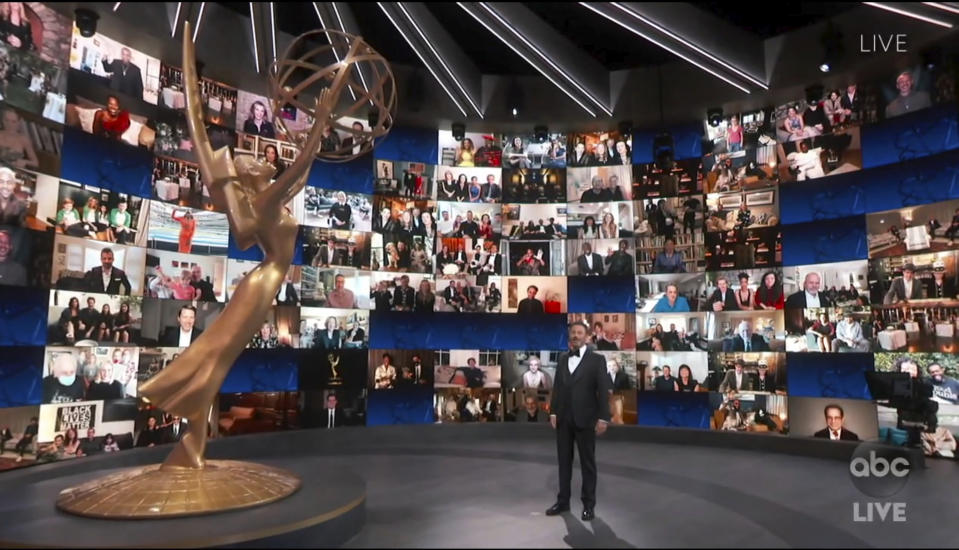 In this video grab captured on Sept. 20, 2020, courtesy of the Academy of Television Arts & Sciences and ABC Entertainment, host Jimmy Kimmel appears with a screen filled with nominees during the 72nd Emmy Awards broadcast. (The Television Academy and ABC Entertainment via AP)